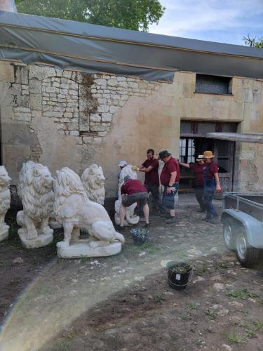 The courtyard of the L'Orangerie, one of the castle's manor houses. Volunteer come together to move Lions
